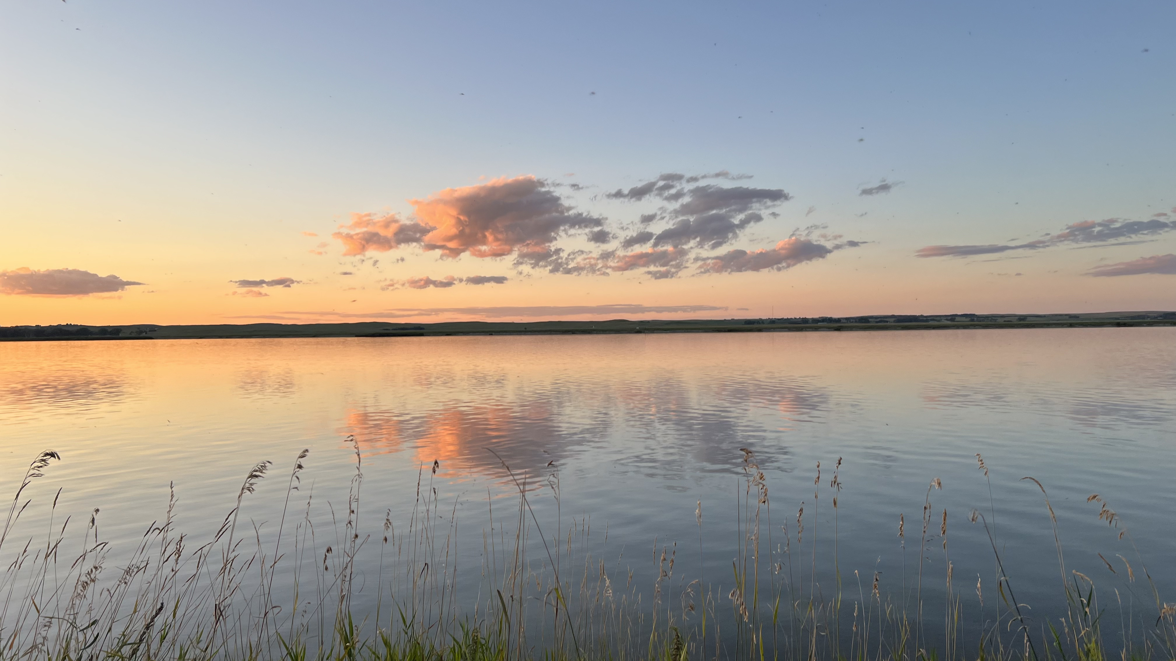 Sunset on clouds reflected in Lake Ogallala