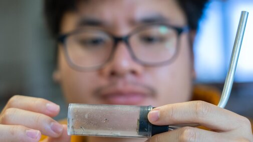 Student collecting midges for research