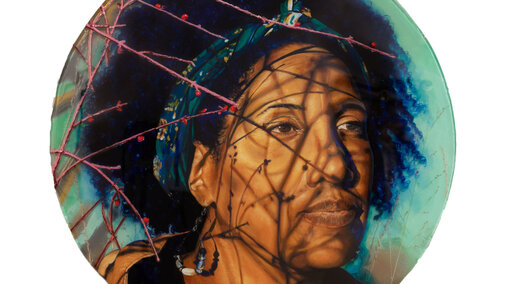 Between Spaces (Charlette Harrington) by Kat Wiese using spray paint, grass, oil, resin on panel. Woman sitting in nature while the sun rises or sets looking out away from audience with budding twigs casting shadows on face.