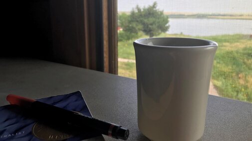Photo book, highlighter, mug, window