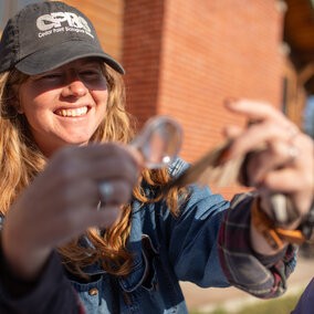 Allison Johnson inspecting a wing