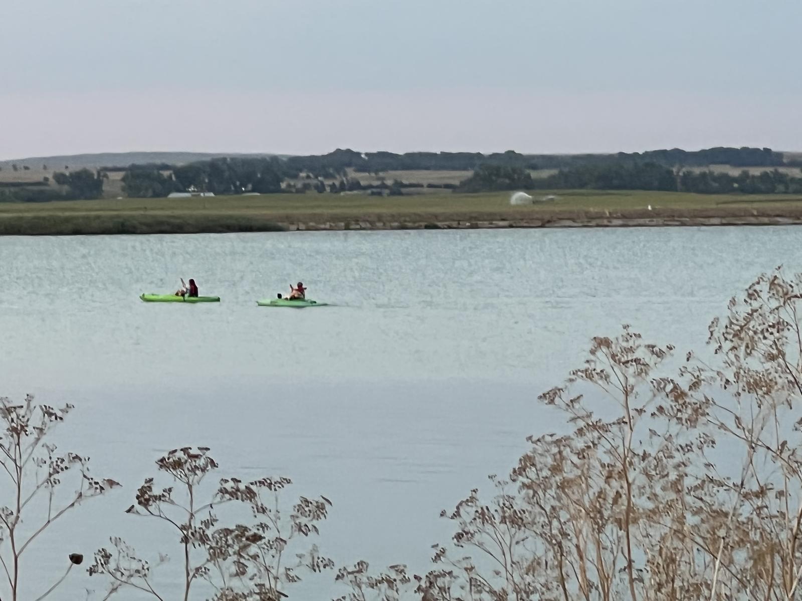 Two people in kayaks on Lake Ogallala